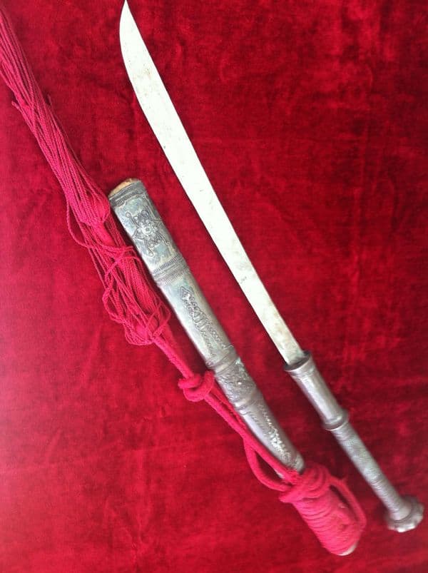 X X X   SOLD  X X X  A Silver Covered Burmese Dha sword. Complete with its original silver covered scabbard. Probably 19th Century. Ref 5560.